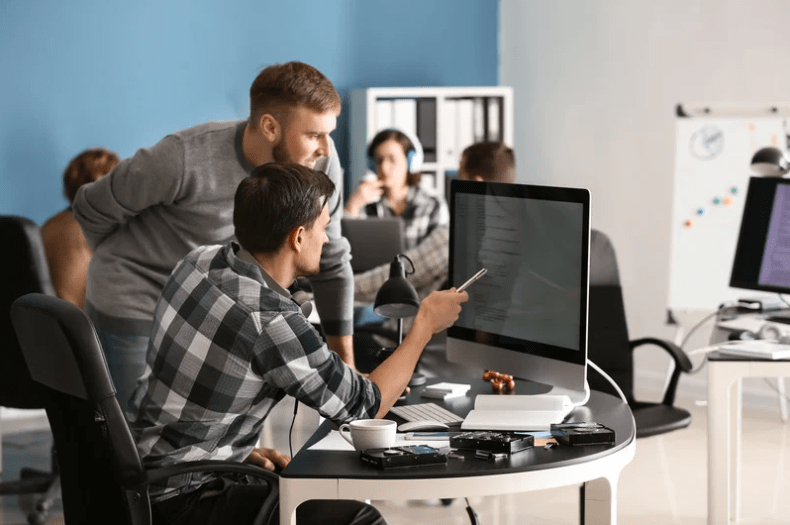 coworkers on computer