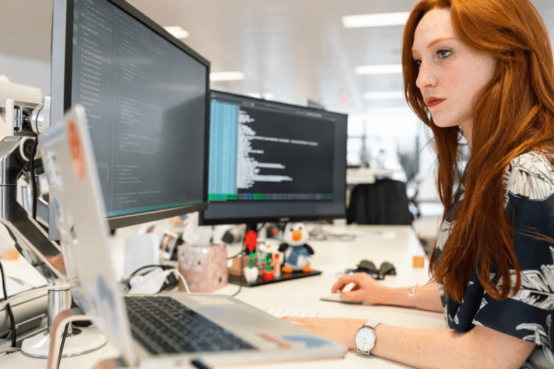 woman inside using computers