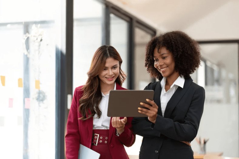 two women smiling marketing agency