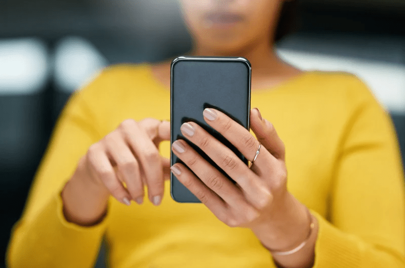 person in yellow shirt phone