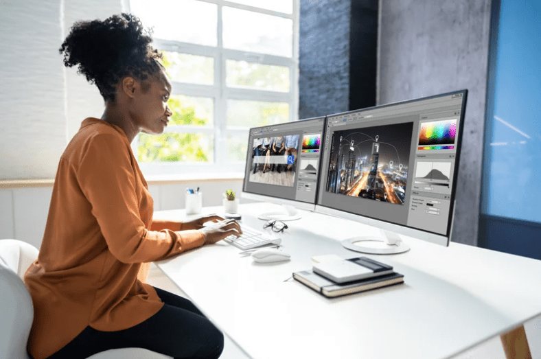 woman in bright office on computer